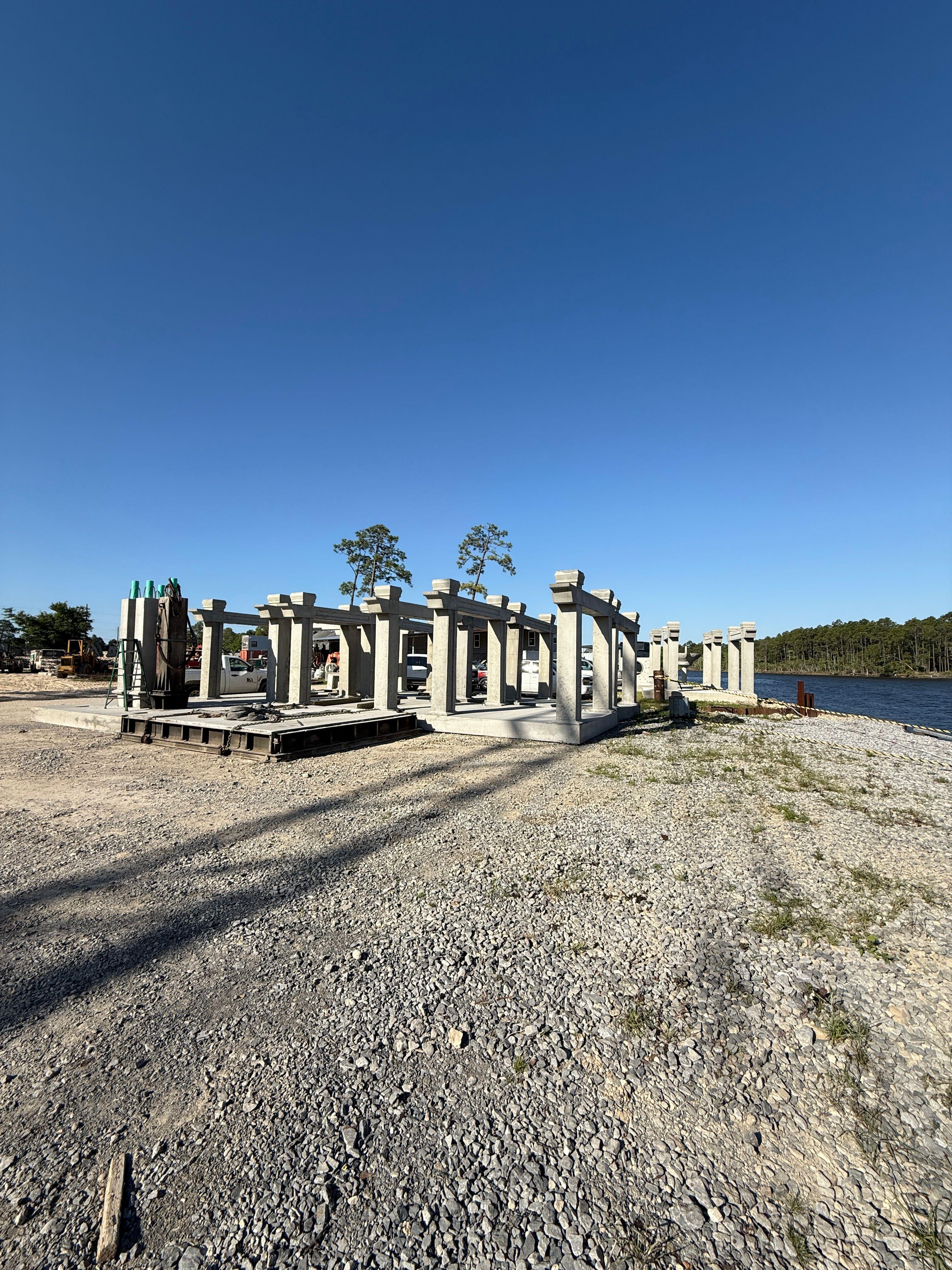 Custom column-style reef structures displayed on land before deployment