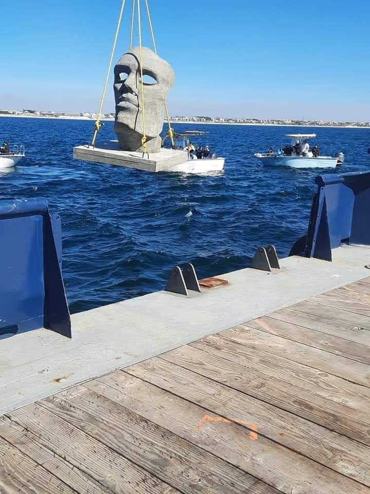 Small artificial reef structure suspended behind a vessel