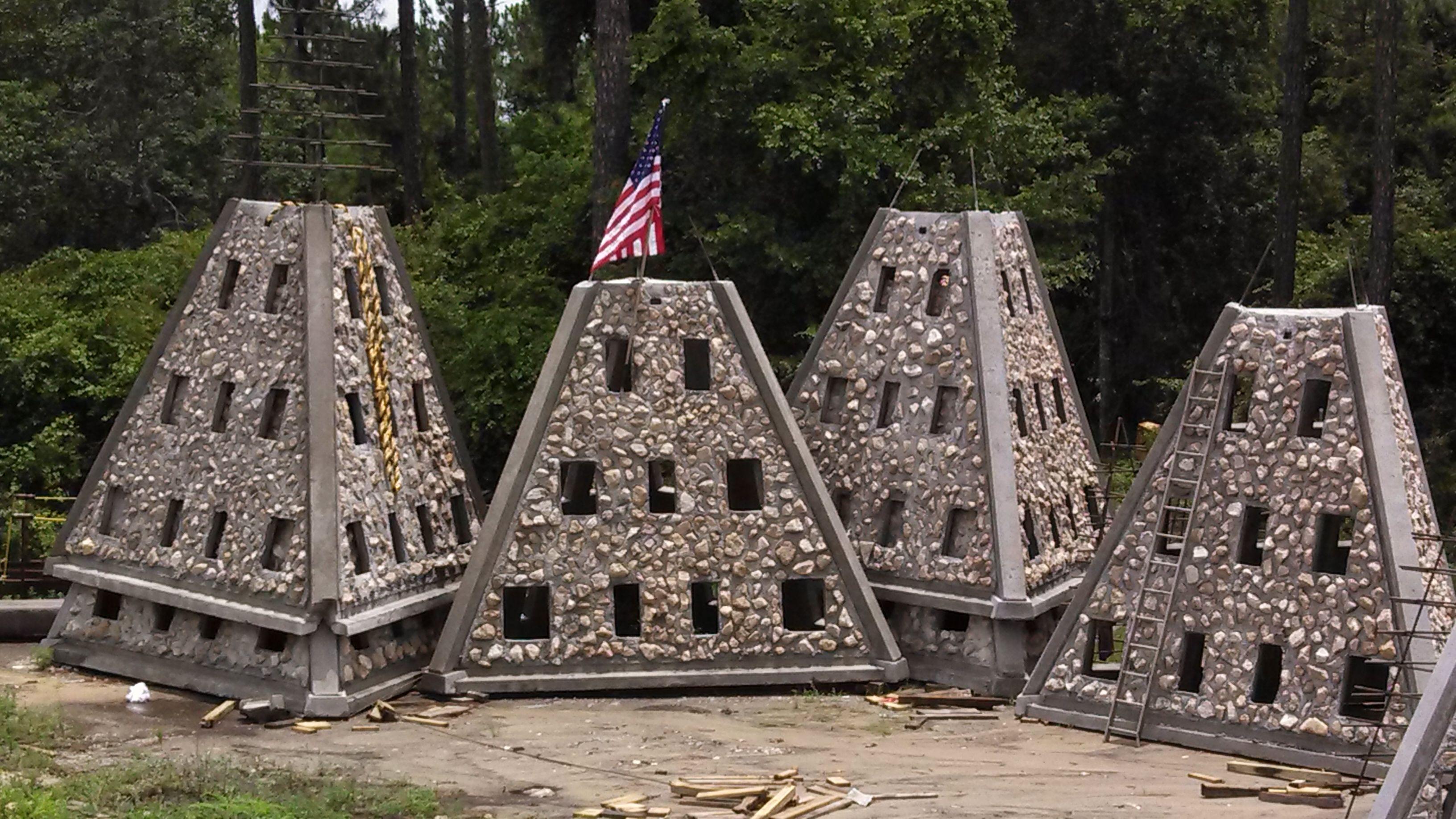 Multiple pyramid-shaped Super Reef modules staged together before deployment